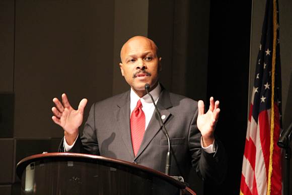 Mr. Maurice Jones, Secretary of Commerce and Trade of Virginia, is making a speech at the conference